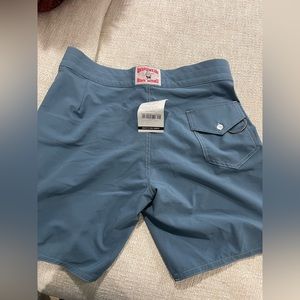 Bundle of men’s bathing suits.